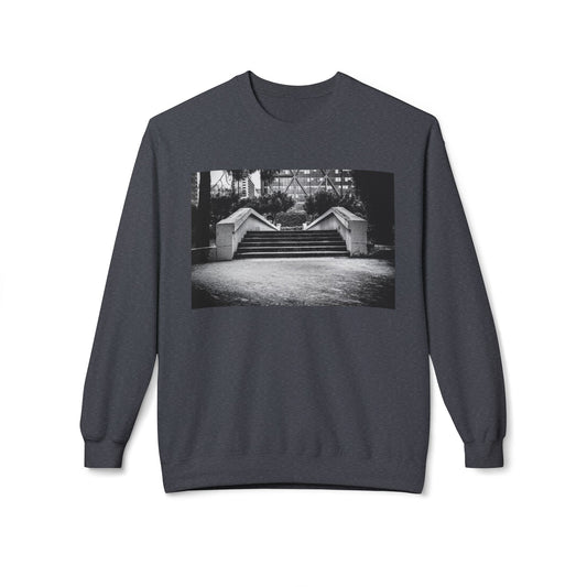 Front view of a dark grey long-sleeve sweatshirt. The soft fabric drapes naturally, showcasing the relaxed fit. Ideal for layering or wearing solo, this piece adds a pop of color with a skate-inspired edge."