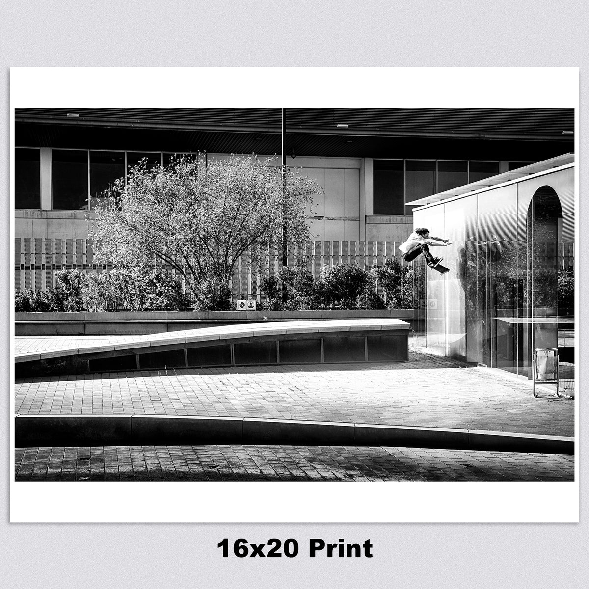 Evan Smith, kickflip wallride off glass building facade, Barcelona 2015, black and white — fine art skate photography print by David Broach