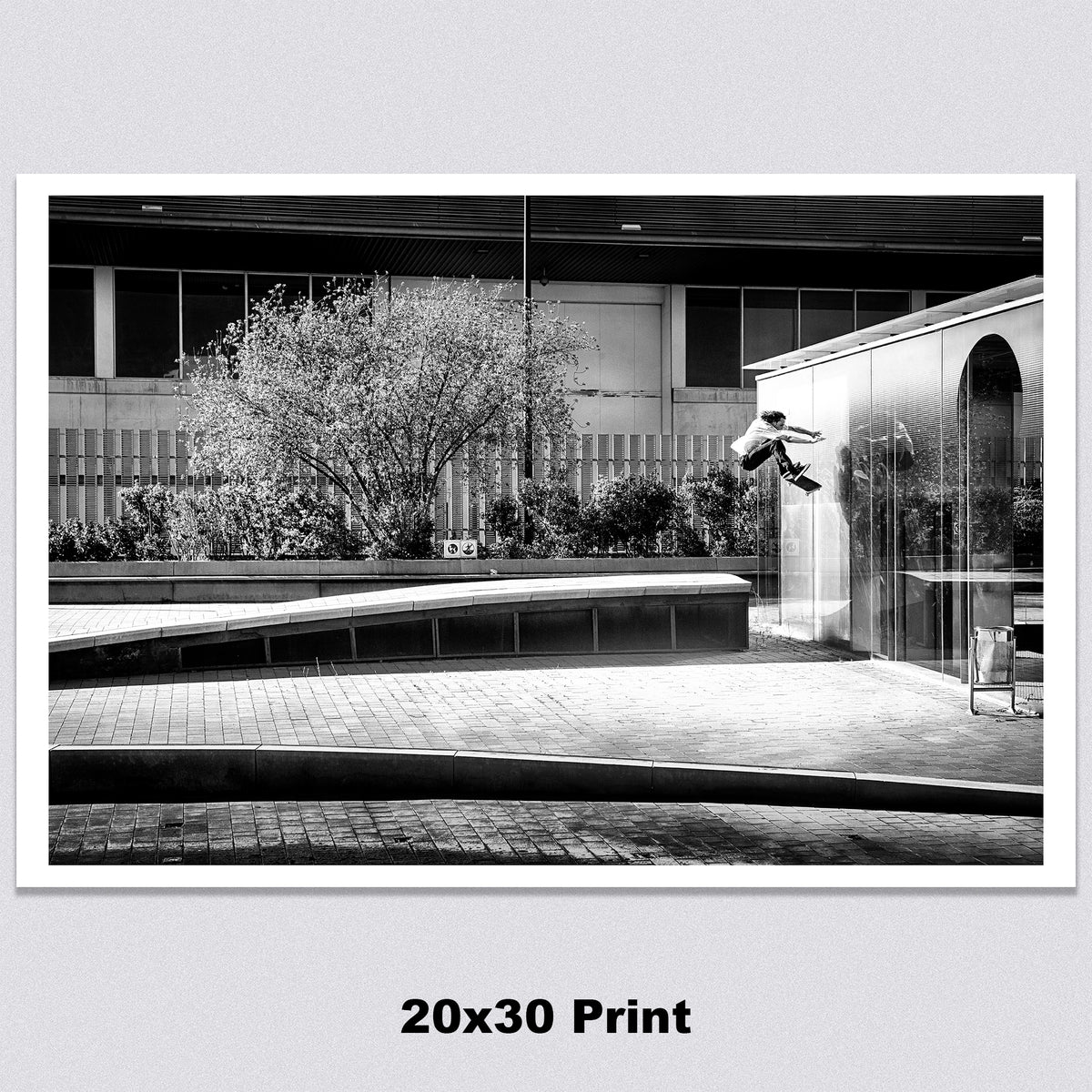 Evan Smith, kickflip wallride off glass building facade, Barcelona 2015, black and white — fine art skate photography print by David Broach
